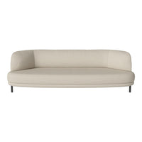 Beige curved sofa with a smooth, minimalist design and sleek black legs. Perfect for modern home decor.