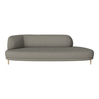 Curved gray sofa with a smooth fabric texture and light wooden legs, featuring a minimalist design.