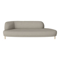 Luxe light gray curved sofa with smooth texture and minimalist design, featuring natural wood legs for a modern look.