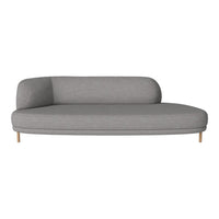 Modern gray curved sofa with smooth fabric and minimalist design, featuring light wood legs.