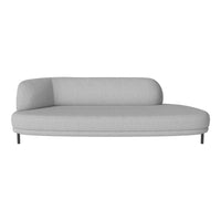 Modern gray sofa with a smooth, minimalist design and a curved backrest, perfect for contemporary living spaces.