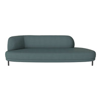 Teal upholstered sofa with a smooth, modern design and curved silhouette, featuring a minimalist style and no visible patterns.