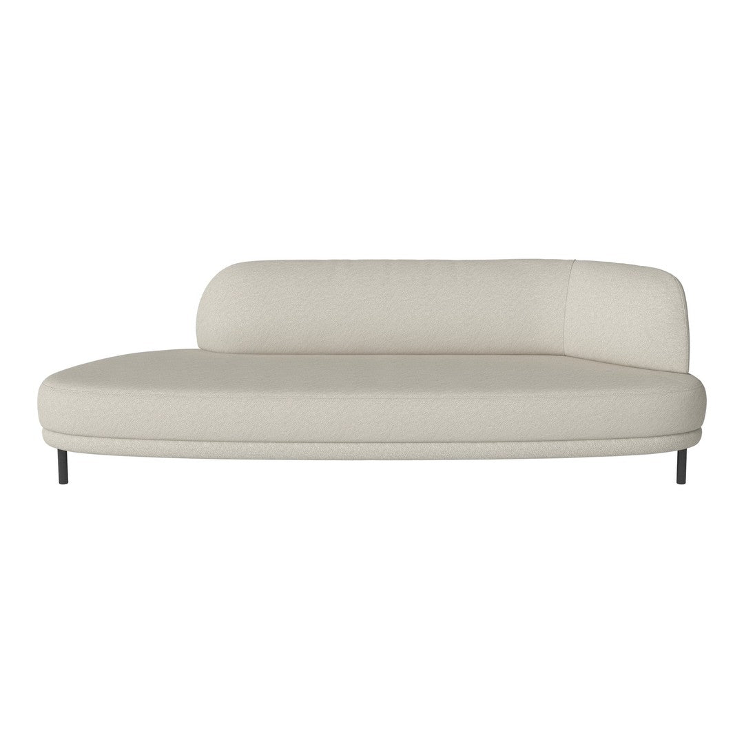 Modern curved sofa in soft beige upholstery with smooth texture and minimalistic design.