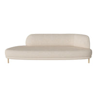 Beige curved sofa with a smooth texture and minimalist design, featuring natural wood legs for a modern look.