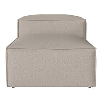 Beige textured sofa with a smooth, minimalist design and no visible patterns. Perfect for modern decor.