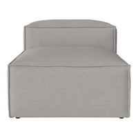 Light gray upholstered chaise lounge with a minimalist design and soft, textured fabric. Perfect for modern decor.