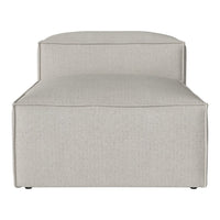 Light gray upholstered chaise lounge with a smooth, minimalist design and subtle textured pattern.