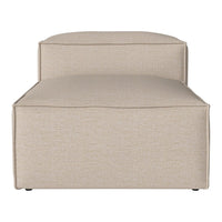 Beige upholstered chaise lounge with a subtle textured pattern, perfect for modern decor.