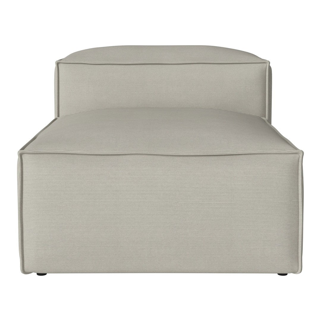 Light beige upholstered chaise lounge with a smooth, minimalist design and subtle stitching details.