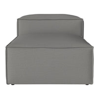 Gray upholstered chaise lounge with a smooth texture and minimalist design. Perfect for modern home decor.