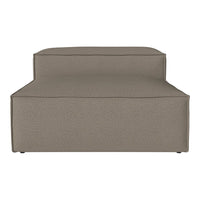 Neutral taupe chaise lounge with a smooth fabric texture and minimalist design, perfect for modern interiors.