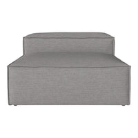 Gray upholstered chaise lounge with a clean, modern design and subtle textured pattern. Perfect for contemporary decor.