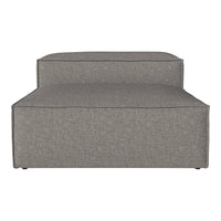 Gray upholstered lounge chair with a textured fabric and minimalist design. Ideal for modern living spaces.