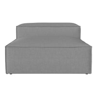 Gray upholstered ottoman with a sleek, minimalist design and clean lines. Ideal for modern interiors.