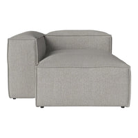 Gray upholstered sectional sofa with a smooth texture and minimalist design. Ideal for modern living spaces.