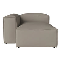 Modern sectional sofa in soft beige fabric, featuring clean lines and a minimalist design. Perfect for contemporary decor.