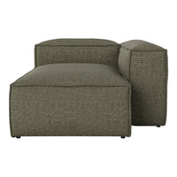 Stylish green lounge chair with a textured ribbed pattern, perfect for modern living spaces.