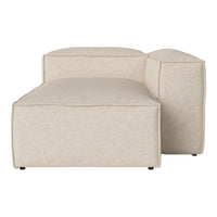 Beige modular sofa with a textured fabric, featuring a minimalist design and clean lines for modern decor.