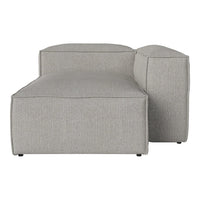 Light gray fabric sectional couch with a smooth texture and minimalistic design. Perfect for modern interiors.