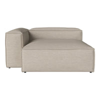 Beige upholstered chaise lounge with a smooth, minimalist design and subtle texture. Perfect for modern decor.
