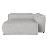 Light gray upholstered sectional sofa with a minimalist square pattern and clean lines. Ideal for modern interiors.