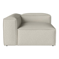 Light grey upholstered sectional sofa with a minimalist design and soft, textured fabric. Perfect for modern interiors.