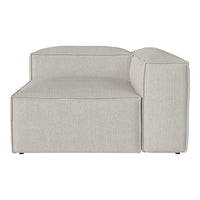 Light beige sectional sofa with a smooth, textured fabric and contemporary design. Clean lines and minimalist style.