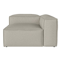 "Light beige modular sofa section with subtle textured pattern, featuring clean lines and a contemporary design."