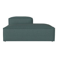 Teal upholstered chaise lounge with a smooth, textured pattern and modern design. Perfect for stylish interiors.