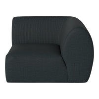 Curved armchair in a textured dark blue fabric with subtle geometric patterning. Ideal for modern interiors.