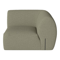 Sleek, curved sofa in soft olive green with a textured fabric and subtle pattern for modern interiors.
