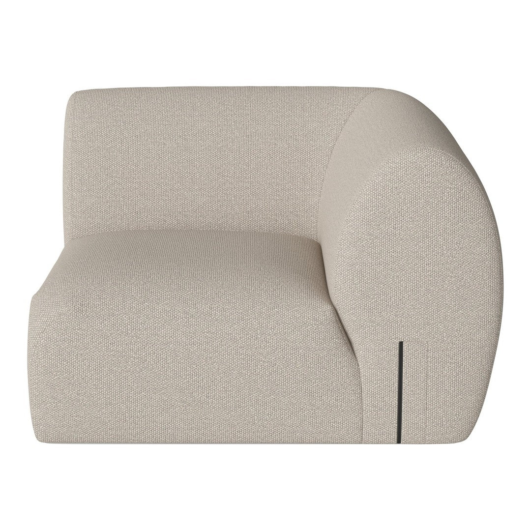 Beige curved accent chair with subtle textured pattern, perfect for modern home decor.