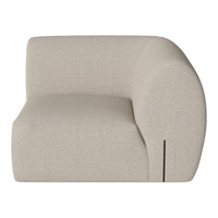 Beige curved accent chair with subtle textured pattern, perfect for modern home decor.