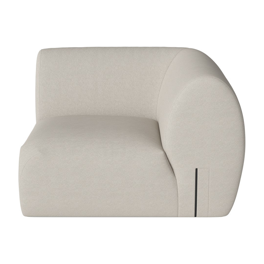 Beige curved sofa with a smooth texture and minimalist design, featuring a modern, clean-line aesthetic.