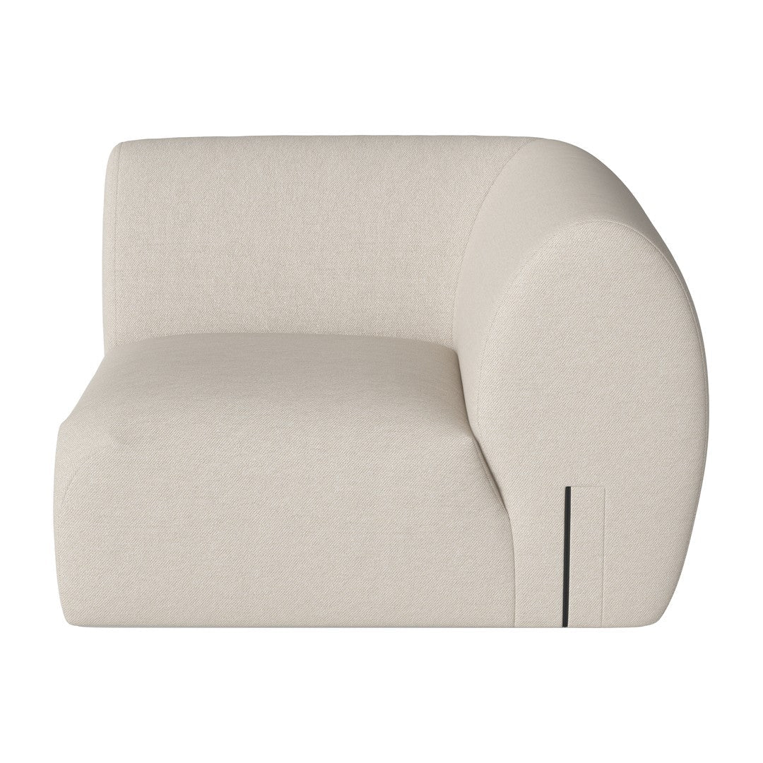 Cream-colored curved armchair with a smooth, minimalist design and soft fabric texture. Perfect for modern interiors.
