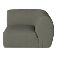 Sleek, curved armchair in soft olive green fabric with a textured pattern for modern decor.