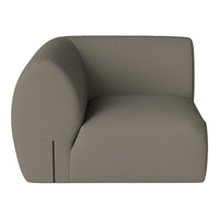 Contemporary beige armchair with a minimalist design and smooth, curved edges. Ideal for modern interiors.