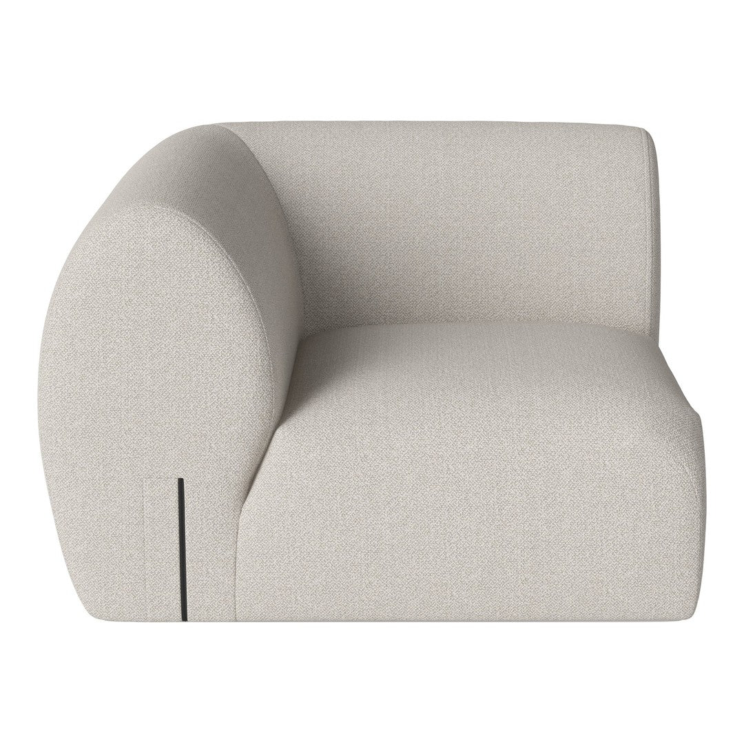 Light beige modular sofa with a smooth, textured fabric and rounded, contemporary design.