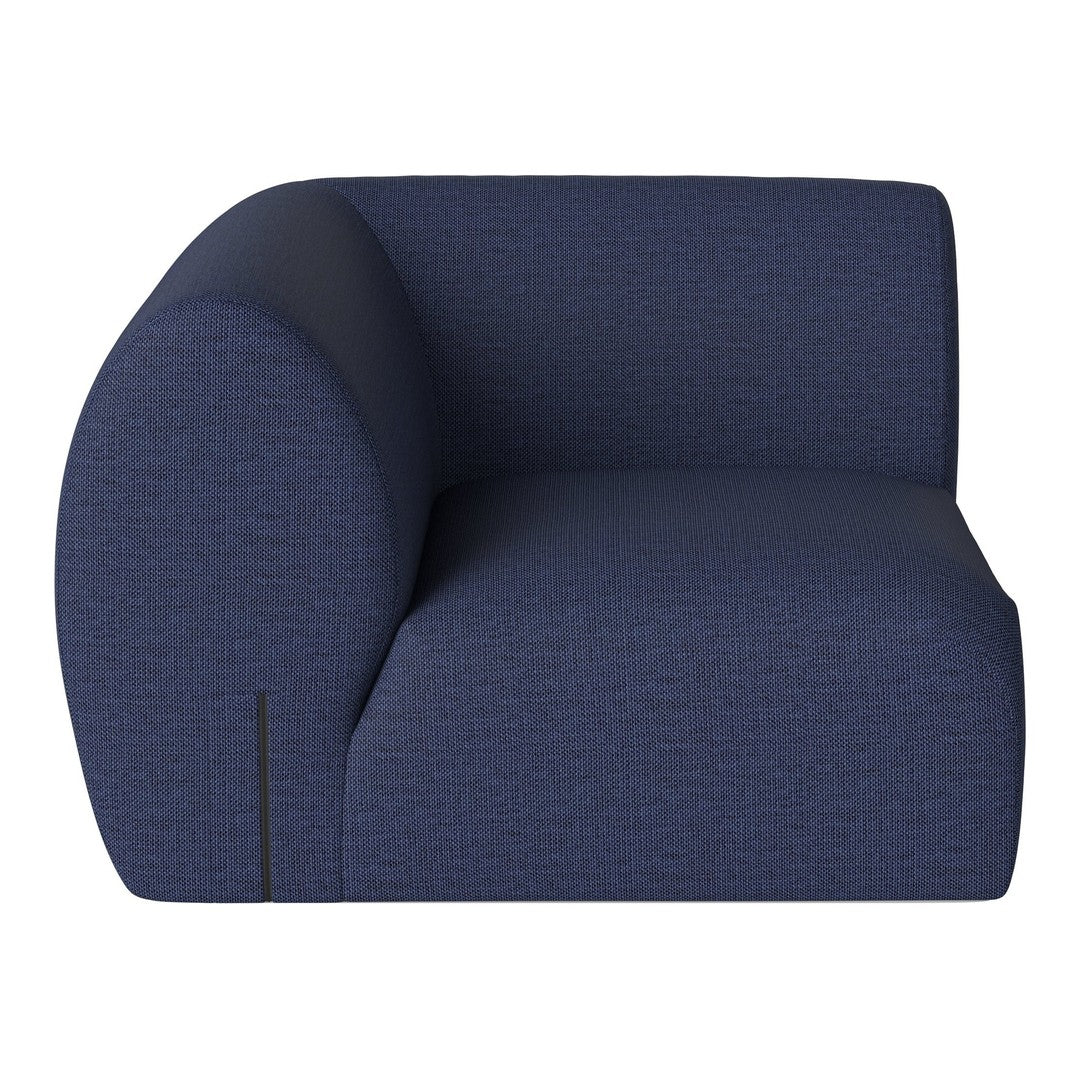 Navy blue curved armchair with subtle textured pattern, perfect for modern decor.