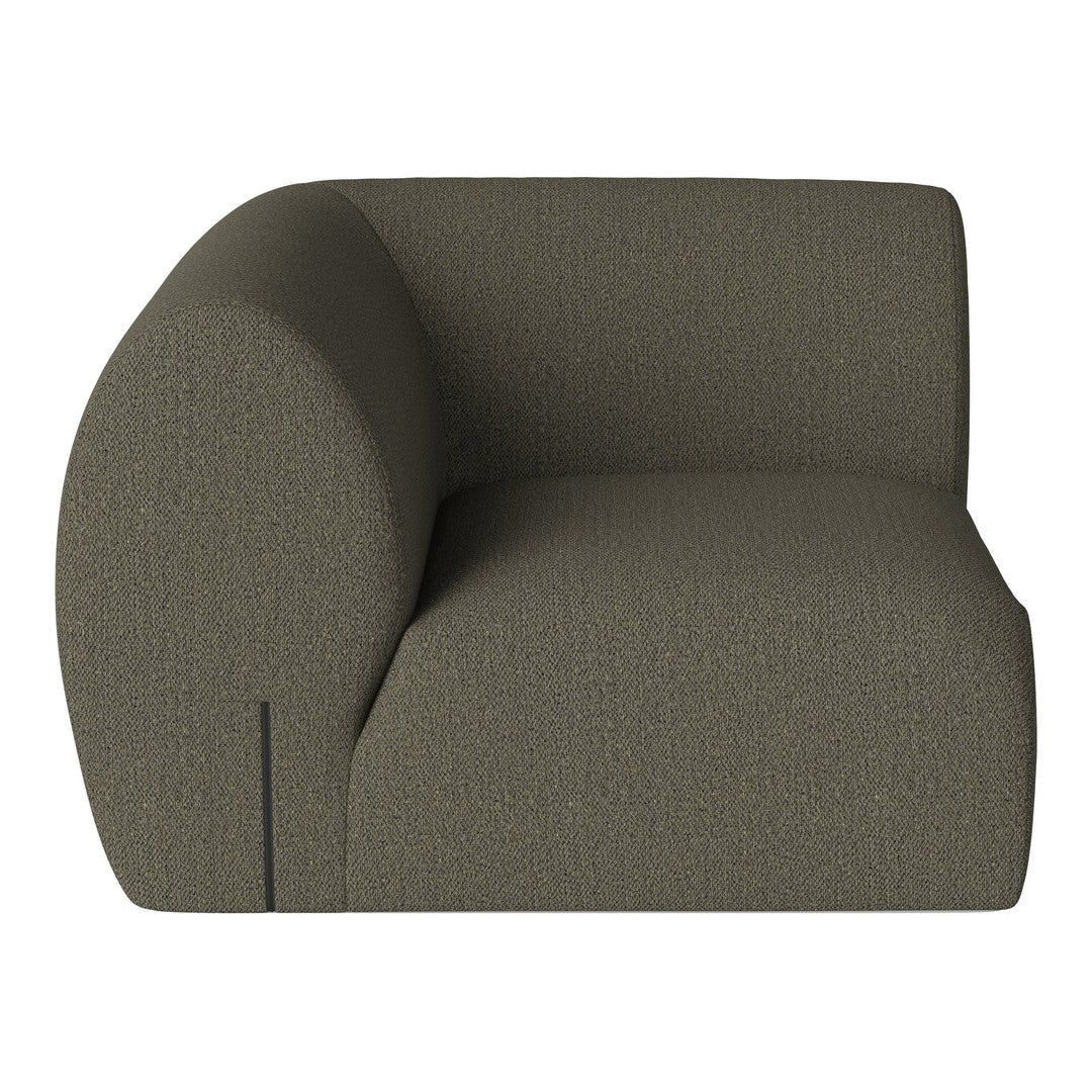 Olive green textured upholstery on contemporary curved armchair, perfect for modern interior decor.