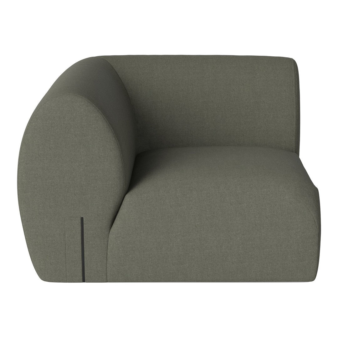 "Modern green fabric sofa with a curved design, featuring a smooth, textured pattern."