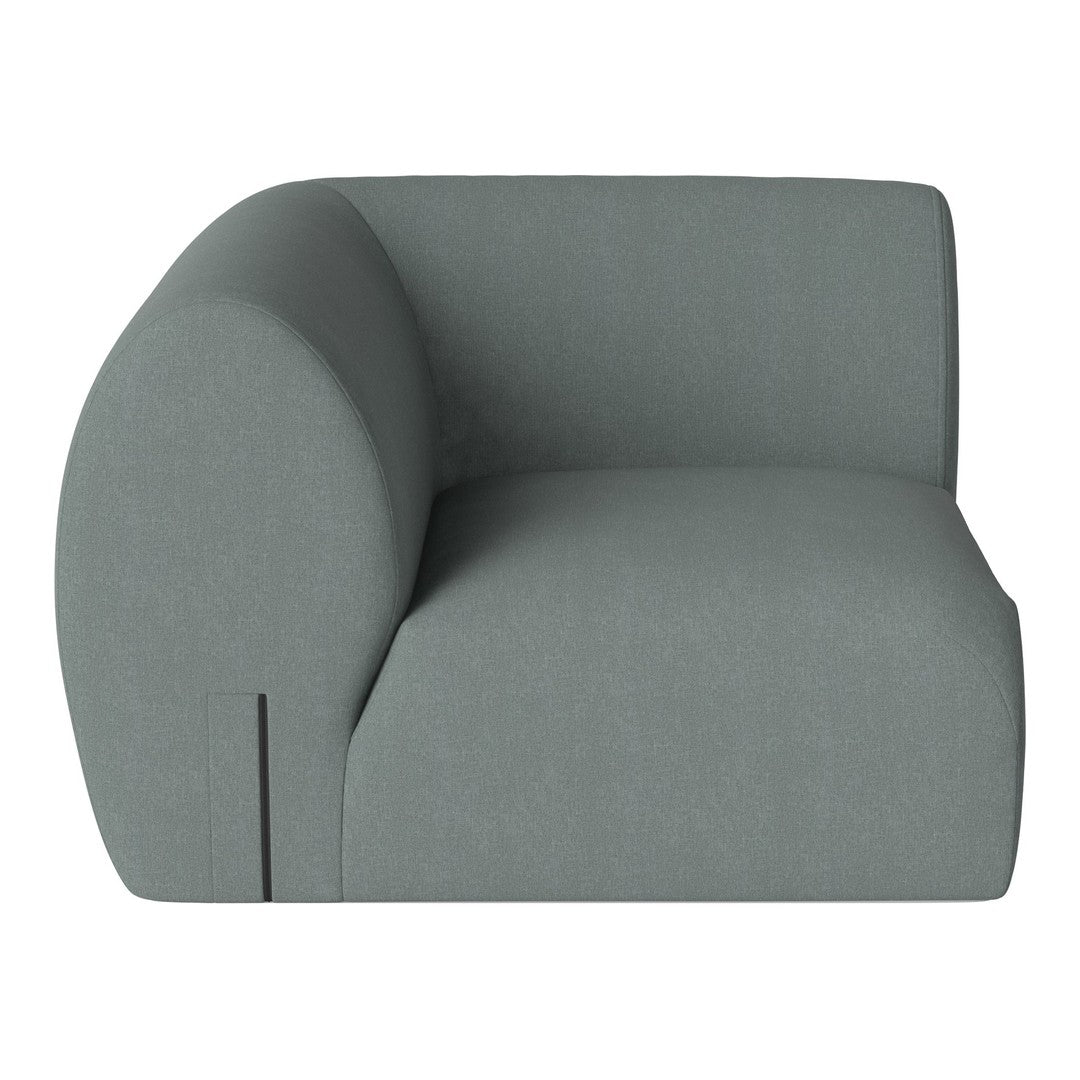 Light green modern accent chair with smooth, curved lines and minimalist design. Perfect for contemporary decor.