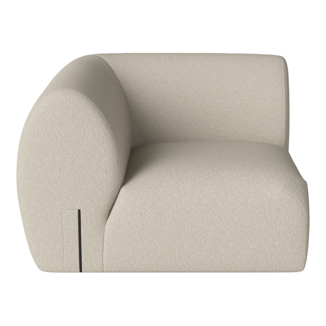 Beige curved sofa with a smooth, textured fabric, featuring minimalist design and no visible patterns.