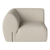 Beige curved sofa with a smooth, textured fabric, featuring minimalist design and no visible patterns.