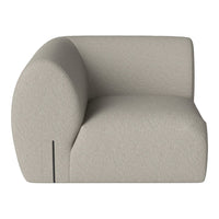 Beige curved upholstered chair with a smooth, textured fabric pattern, designed for modern interiors.