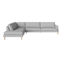 Light gray sectional sofa with clean lines and a minimalist design, featuring plush cushions and wooden legs.