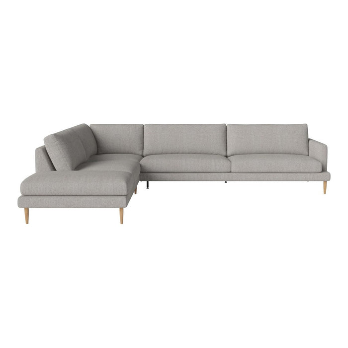 Gray sectional sofa with sleek lines and minimalist design, featuring light wooden legs for a modern aesthetic.