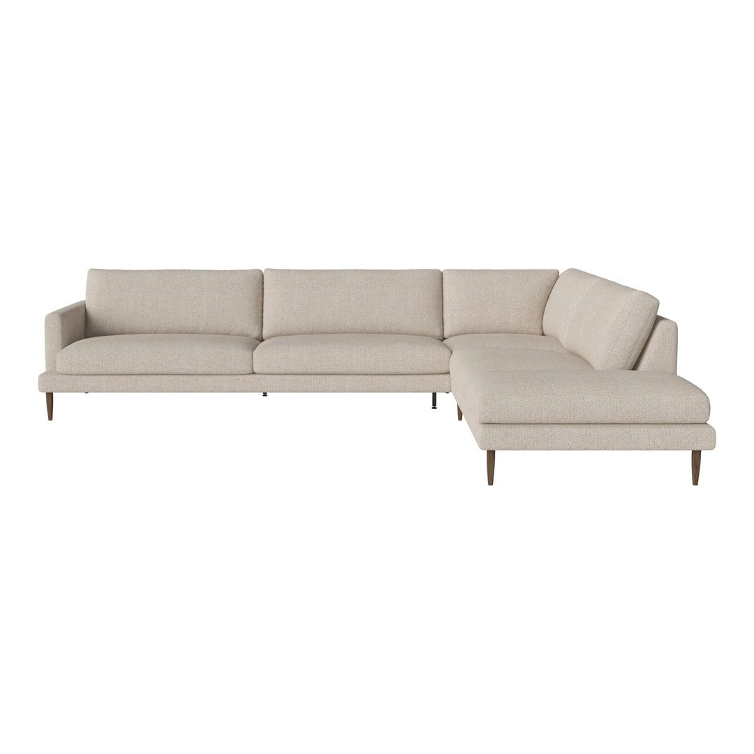 Light beige sectional sofa with minimalist design and smooth fabric texture. Perfect for modern living spaces.