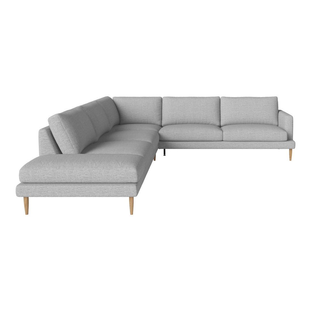 Light gray sectional sofa with a clean, modern design and wooden legs, perfect for contemporary living spaces.