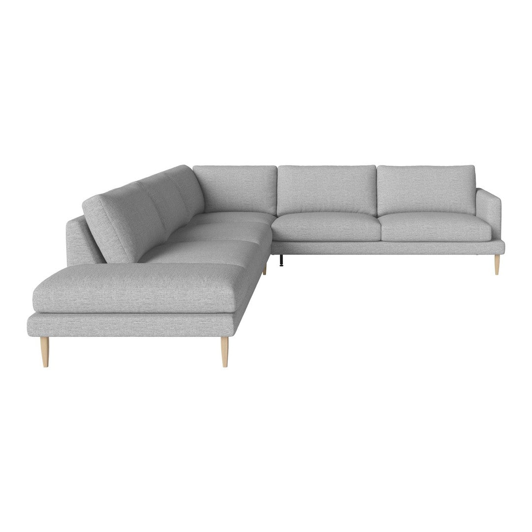 Light gray sectional sofa with a minimalist design and soft fabric, featuring clean lines and wooden legs.